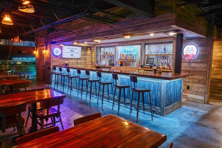 The Wharf bar lined with high-top stools