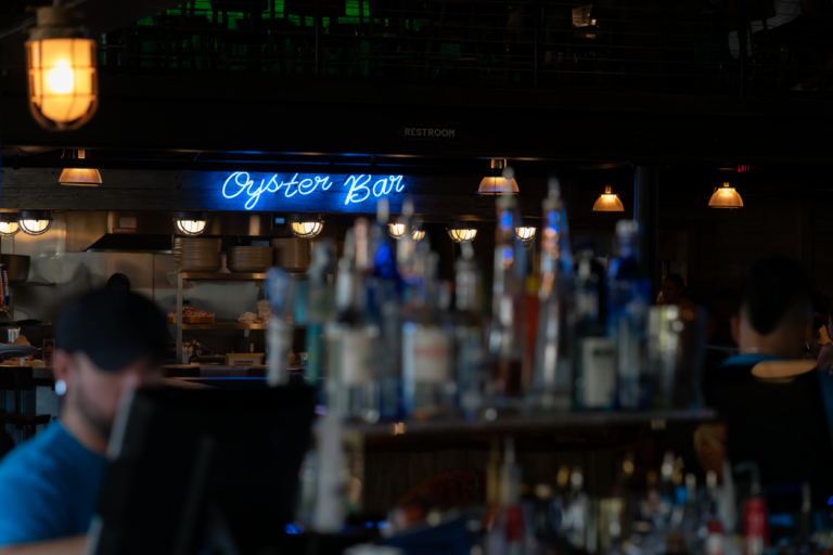 Neon Oyster Bar sign at the Wharf restaurant