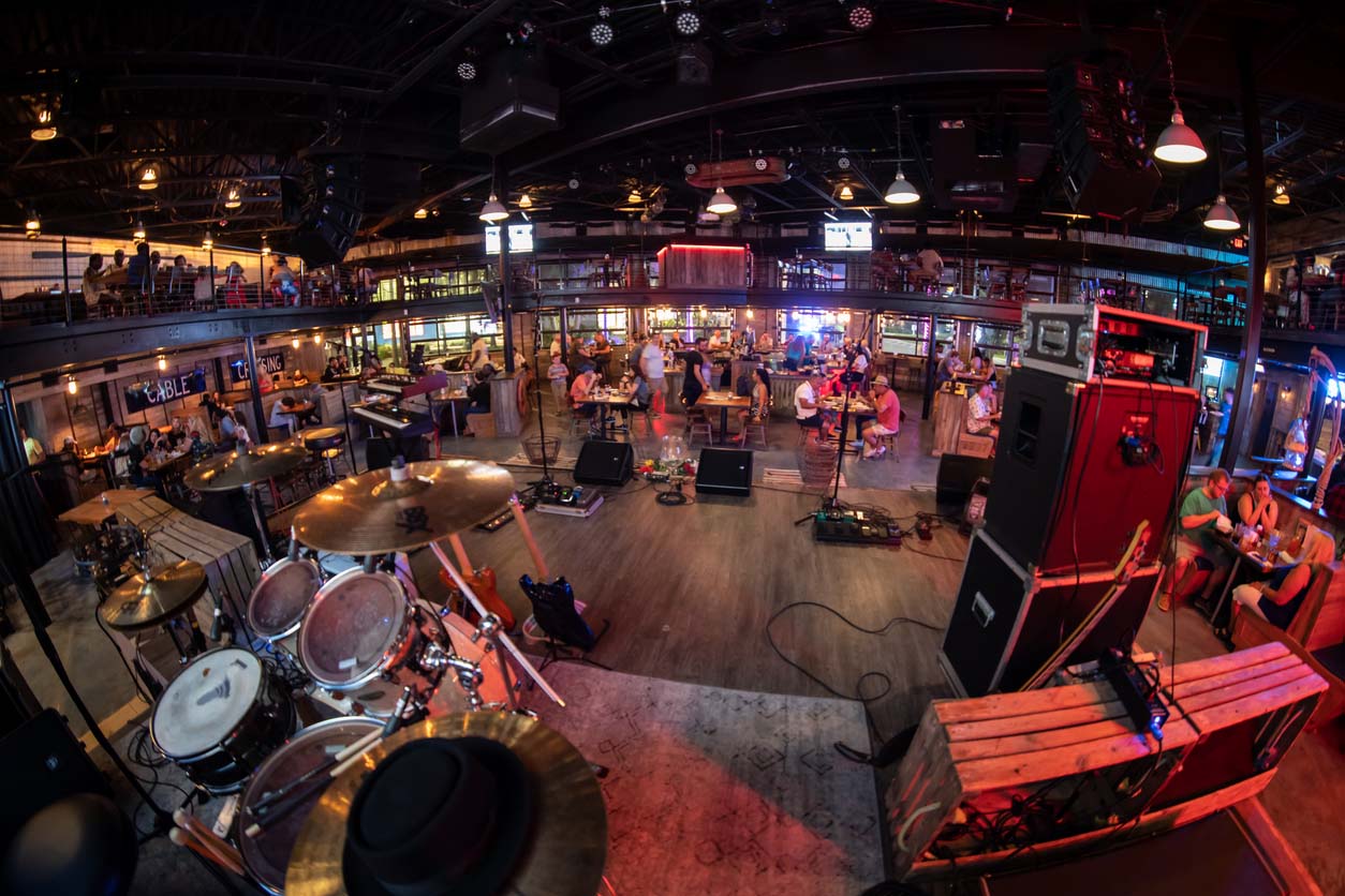 The Wharf dining room as viewed from the stage behind the drum set before a live music performance