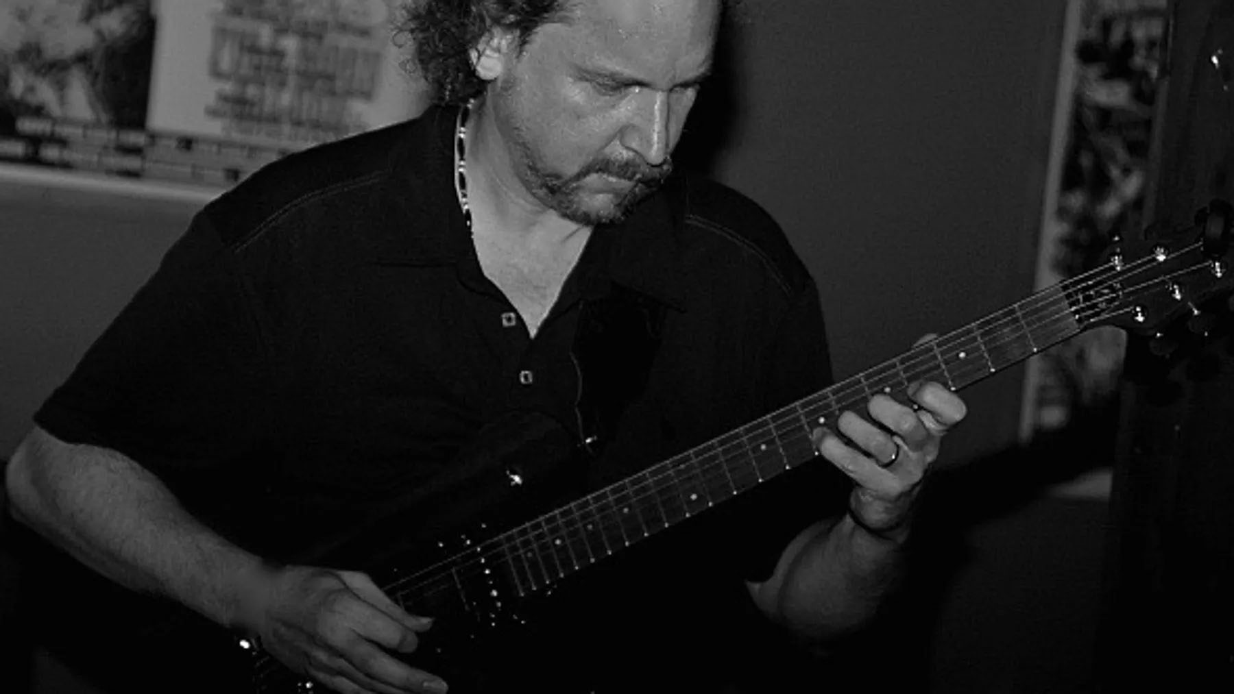 Dennis Haklar playing guitar