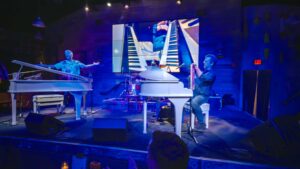 Dueling piano players perform on stage at The Wharf during Dockside Dueling Pianos