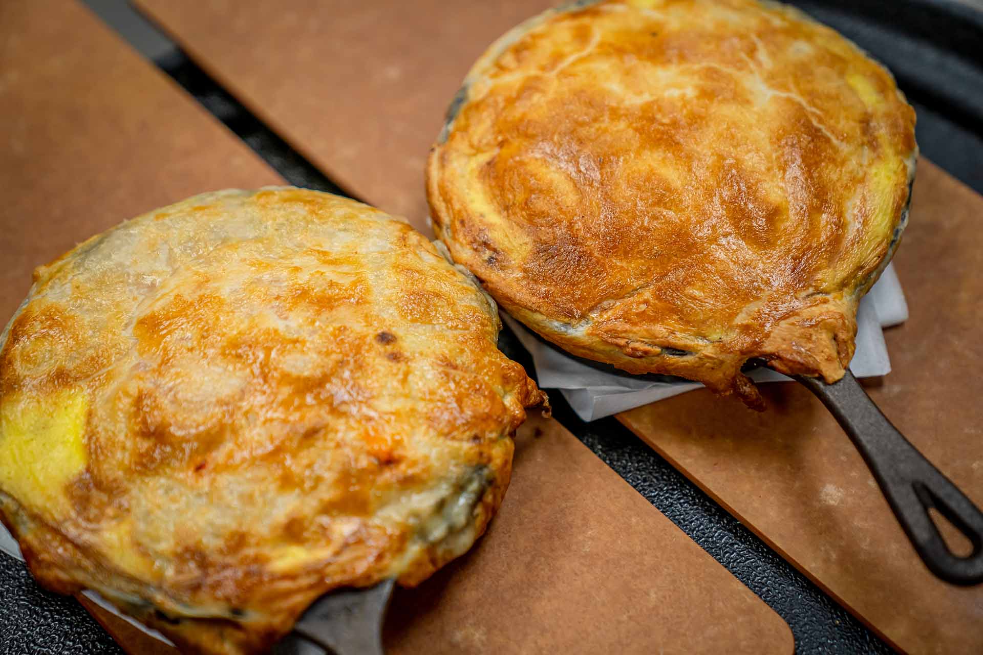 Close up of cast iron seafood pot pies